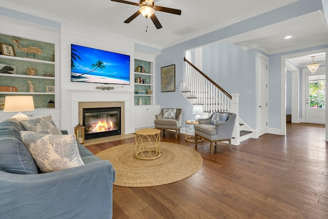 1325 Whisker Pole Ln, Mount Pleasant, SC 29466 - living room with ornamental molding, wood finished floors, a fireplace with flush hearth, built in features, and baseboards