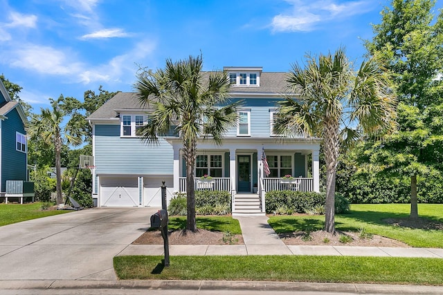 1325 Whisker Pole Ln, Mount Pleasant, SC 29466 - view of front of house featuring an attached garage, a porch, concrete driveway, and a front yard