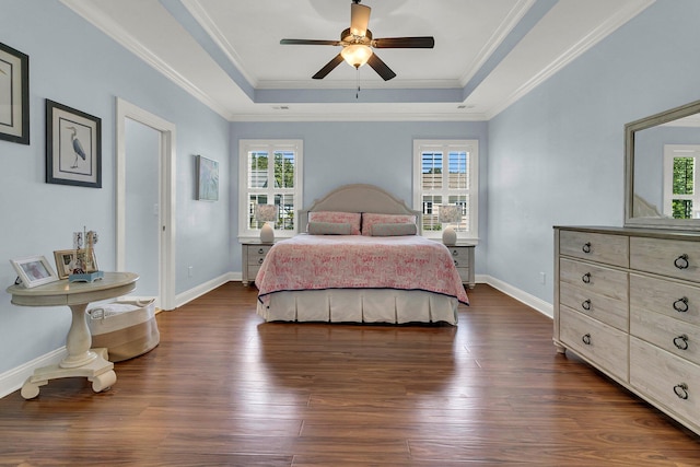 1325 Whisker Pole Ln, Mount Pleasant, SC 29466 - bedroom with a tray ceiling, dark wood-type flooring, baseboards, crown molding, and ceiling fan