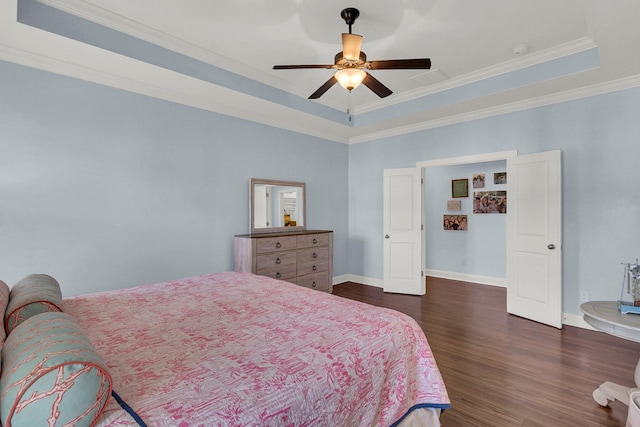 1325 Whisker Pole Ln, Mount Pleasant, SC 29466 - bedroom featuring dark wood-style flooring, a raised ceiling, baseboards, ornamental molding, and ceiling fan