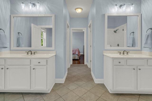 1325 Whisker Pole Ln, Mount Pleasant, SC 29466 - ensuite bathroom featuring a shower stall, tile patterned floors, two vanities, and baseboards