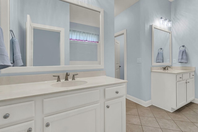 1325 Whisker Pole Ln, Mount Pleasant, SC 29466 - bathroom featuring two vanities, tile patterned flooring, and baseboards