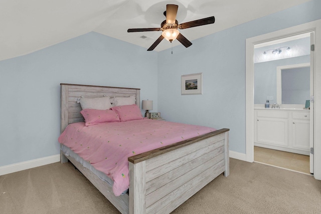 1325 Whisker Pole Ln, Mount Pleasant, SC 29466 - bedroom with light colored carpet, vaulted ceiling, ensuite bath, a sink, and ceiling fan