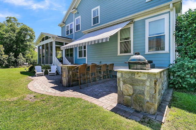 1325 Whisker Pole Ln, Mount Pleasant, SC 29466 - rear view of house featuring a patio, a sunroom, and a yard