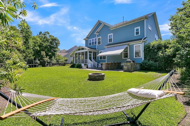 1325 Whisker Pole Ln, Mount Pleasant, SC 29466 - back of house with a sunroom, a fire pit, and a yard