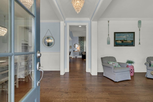 1325 Whisker Pole Ln, Mount Pleasant, SC 29466 - foyer entrance featuring a chandelier, dark wood-type flooring, crown molding, wainscoting, and a decorative wall