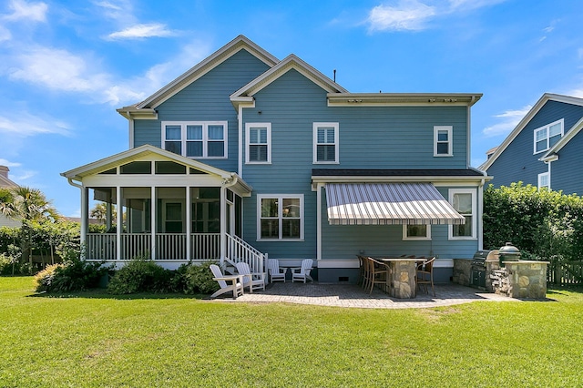 1325 Whisker Pole Ln, Mount Pleasant, SC 29466 - rear view of property with a sunroom, a yard, an outdoor kitchen, and a patio area