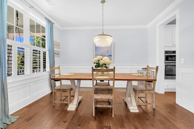 1325 Whisker Pole Ln, Mount Pleasant, SC 29466 - dining space featuring ornamental molding, wood finished floors, a chandelier, a decorative wall, and a wainscoted wall