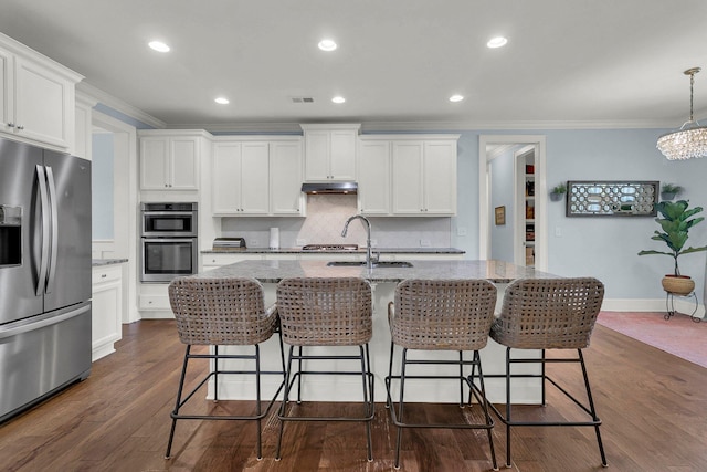 1325 Whisker Pole Ln, Mount Pleasant, SC 29466 - kitchen featuring stainless steel appliances, ornamental molding, a sink, tasteful backsplash, and stone countertops