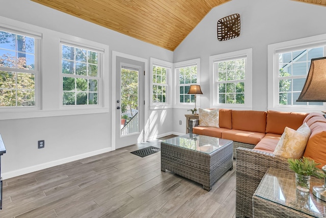 sunroom with lofted ceiling and wooden ceiling