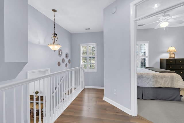 hallway featuring dark hardwood / wood-style floors