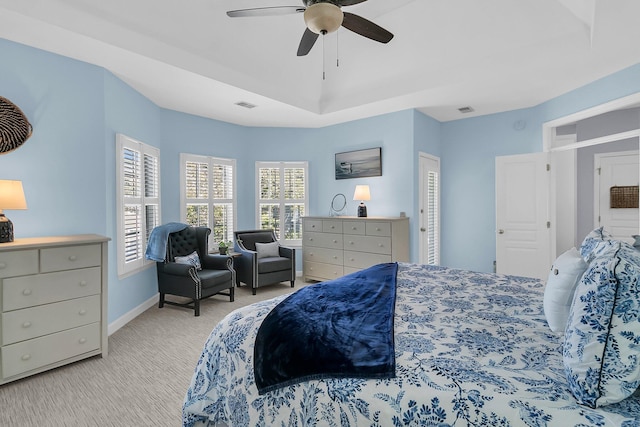 bedroom featuring light carpet and ceiling fan