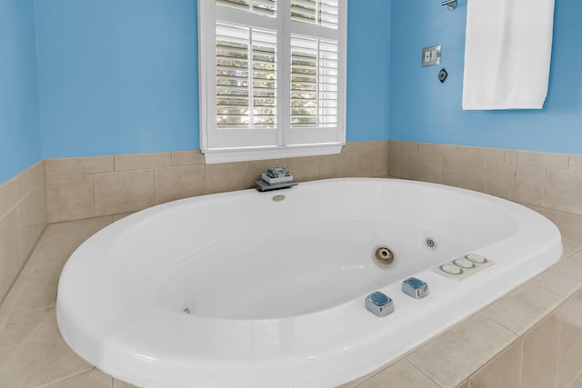 bathroom featuring tiled bath