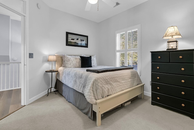 bedroom with light colored carpet and ceiling fan