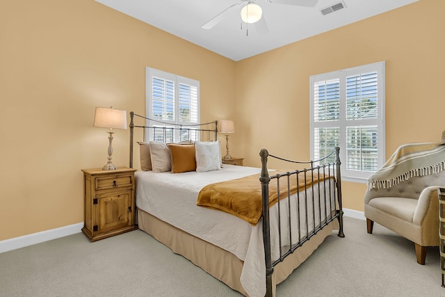 bedroom featuring ceiling fan and light colored carpet