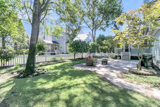 view of yard featuring a sunroom and a patio area