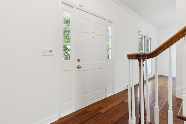 entrance foyer with hardwood / wood-style floors and ornamental molding