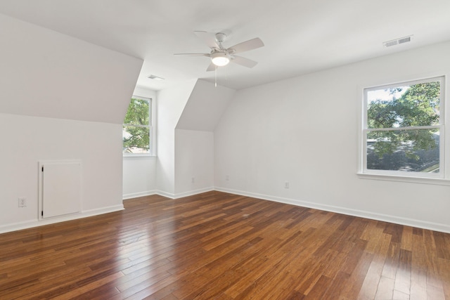 bonus room with ceiling fan, lofted ceiling, and dark wood-type flooring