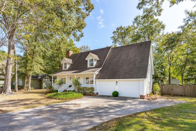 cape cod house with a porch and a garage