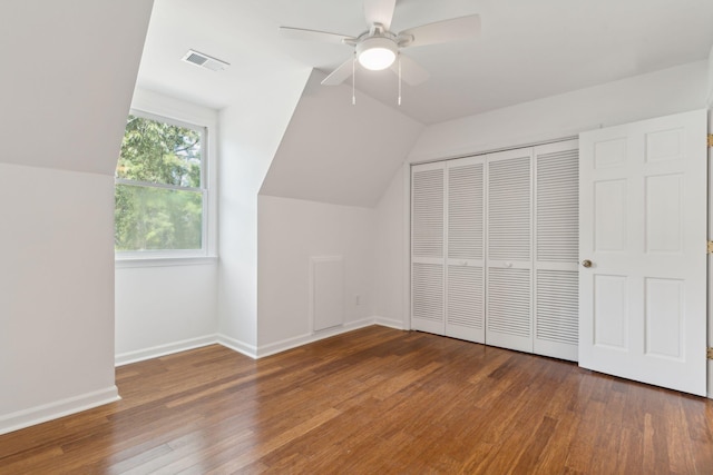 bonus room featuring ceiling fan, dark hardwood / wood-style flooring, and lofted ceiling