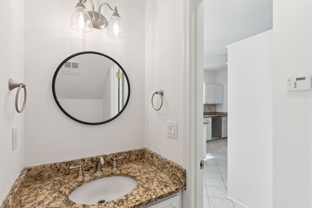 bathroom with tile patterned flooring and vanity