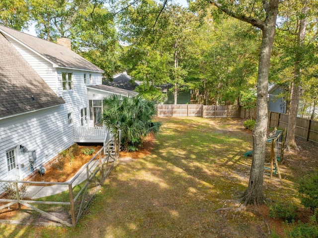 view of yard with a wooden deck