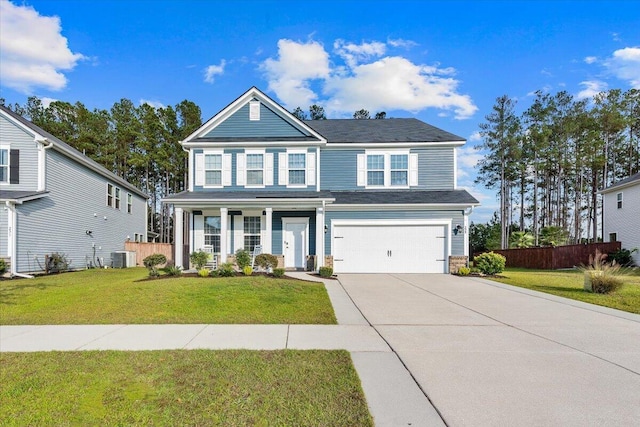 view of front of property with cooling unit, a front lawn, and a garage