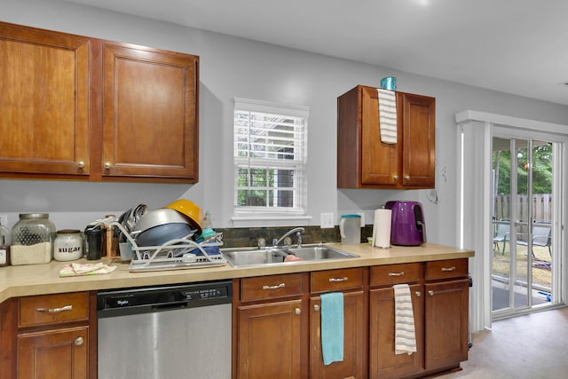 kitchen with a wealth of natural light, dishwasher, and sink