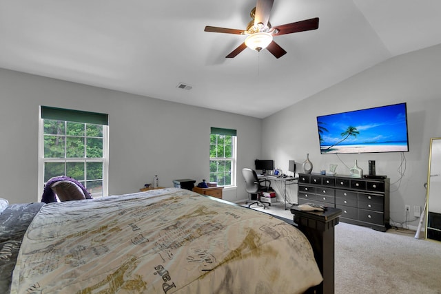 carpeted bedroom featuring vaulted ceiling and ceiling fan