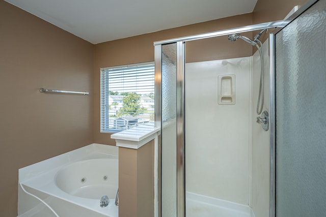 bathroom featuring plus walk in shower