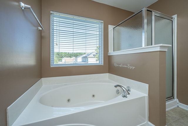 bathroom featuring tile patterned floors and plus walk in shower