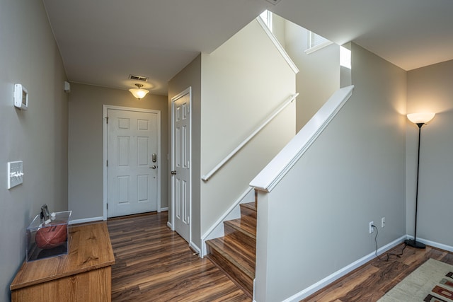 stairway featuring wood-type flooring