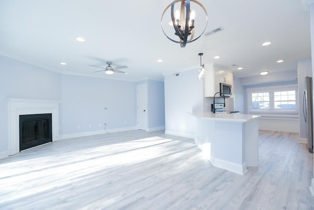 unfurnished living room featuring recessed lighting, visible vents, baseboards, and light wood-style floors