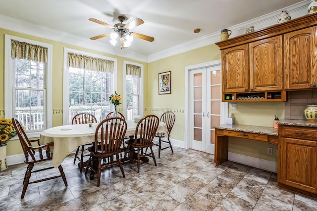 dining room featuring french doors, ceiling fan, and crown molding