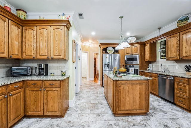 kitchen with stainless steel appliances, tasteful backsplash, light stone counters, pendant lighting, and ornamental molding