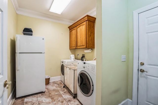 clothes washing area with cabinets, washer hookup, and ornamental molding