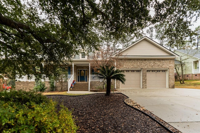 view of front of property featuring a porch and a garage