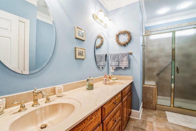 bathroom with tile patterned floors, vanity, an enclosed shower, and ornamental molding