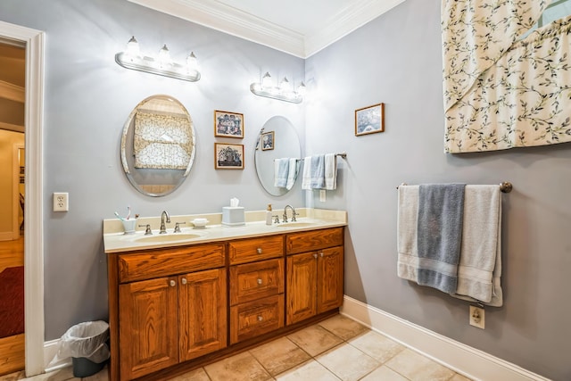 bathroom featuring tile patterned floors, crown molding, and vanity