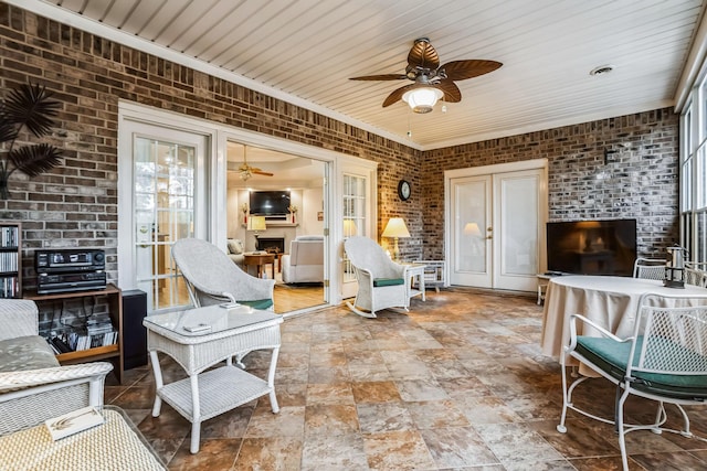 interior space with brick wall and french doors