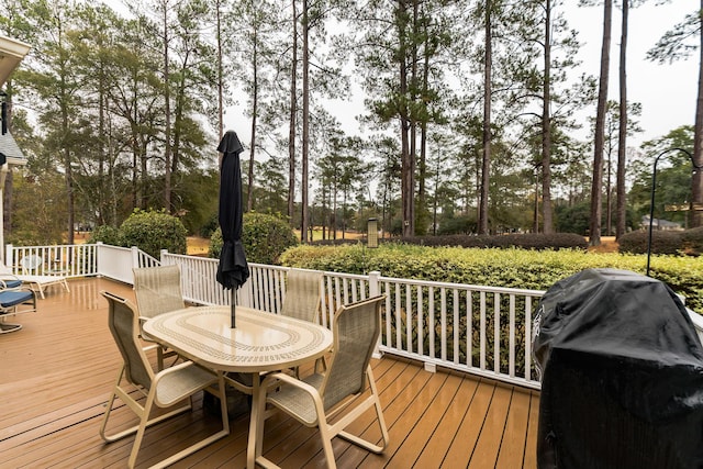 wooden deck featuring grilling area