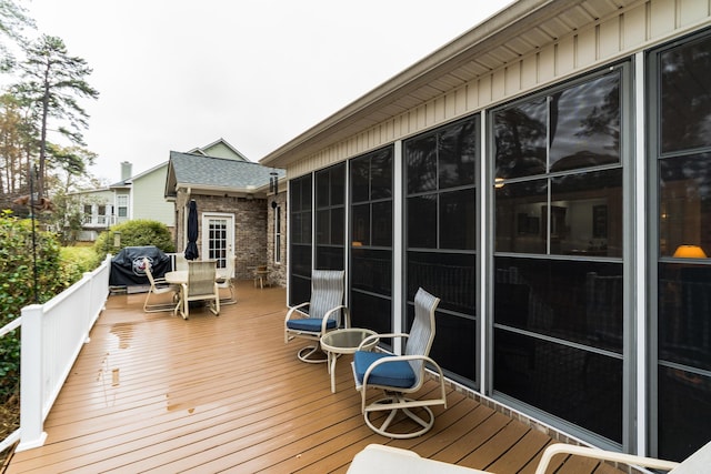 wooden deck with area for grilling