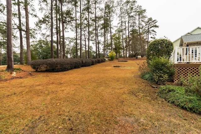 view of yard featuring a wooden deck