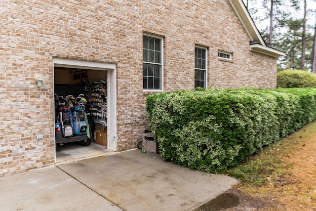 view of exterior entry with a garage