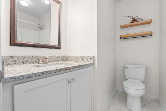 bathroom with toilet, vanity, and a shower