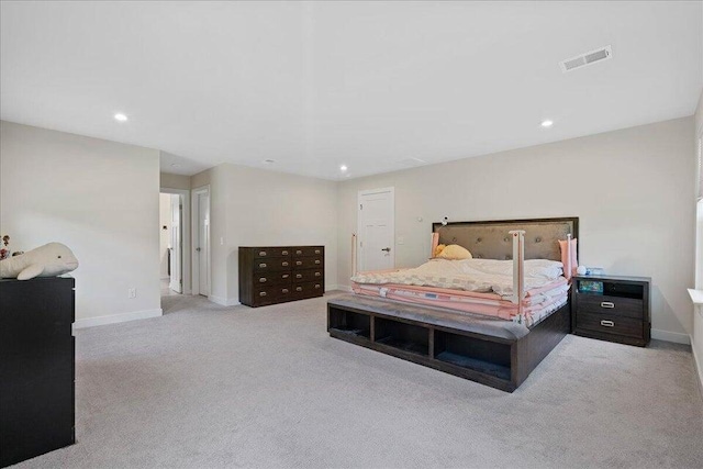 bedroom with light colored carpet