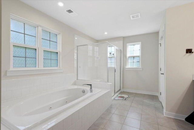 bathroom with tile patterned flooring and plus walk in shower