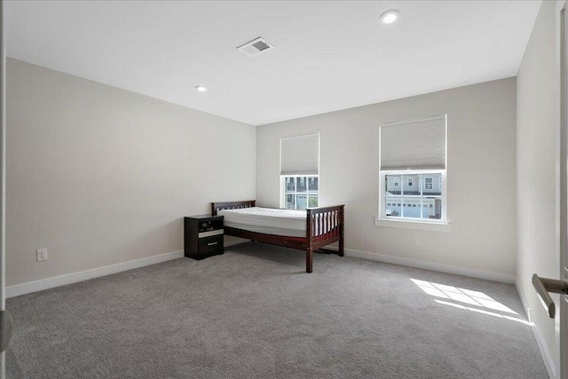 bedroom with light carpet