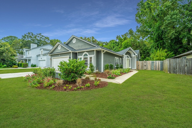 view of front of house featuring a front yard and a garage