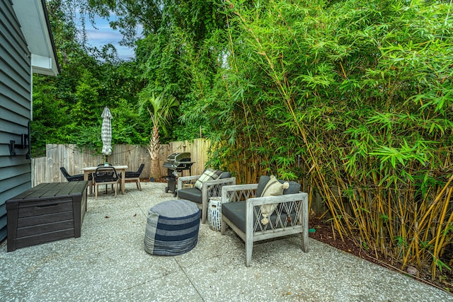 view of patio with an outdoor hangout area and a grill